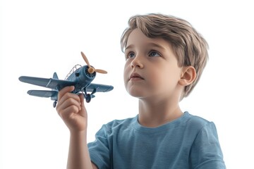 young boy holding toy airplane