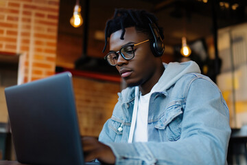 Wall Mural - Young Professional Typing on Laptop Keyboard