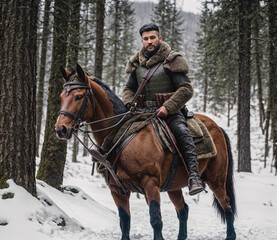 A man is riding a brown horse in a snowy forest