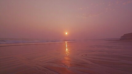 Wall Mural -   The sun sets over the beach, with water and sand in clear view