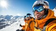 © LifeMedia - Two skiers in orange jackets taking a break on a snowy mountain ridge, basking in the bright sunlight, with breathtaking panoramic views of the surrounding snow-covered peaks.