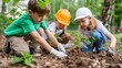 © LifeMedia - Three young children participate in a community environmental effort, planting trees with dedication and teamwork, wearing protective gear in a lush green setting.