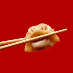 Poster - A delicious dumpling held with chopsticks against a bold red background. This appetizing food photo captures the essence of Asian cuisine. Perfect for food blogs and culinary art. AI