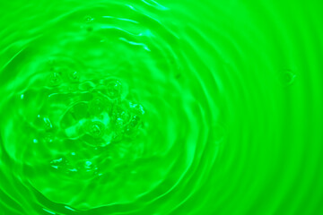 Wall Mural - the green water surface reflects light.