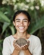© Ryzhkov - Joyful Hispanic Woman Celebrating Earth Day by Holding Soil in a Green Forest Setting