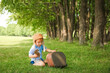 © Kostia - A Baby boy by the plane plays on nature in the park. Boy on vacation pilot.