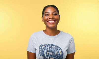 Wall Mural - Young african american woman with white t-shirt on yellow background