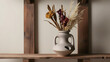 © Gang studio - Artistic ceramic vase with dried flowers on a wooden shelf.