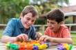 © Dassen - Two boys playing with building blocks and having fun