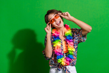 Poster - Photo of funky woman dressed print blouse colorful necklace touch sunglass staring at offer empty space isolated on green color background