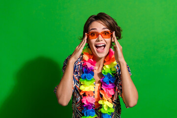 Sticker - Photo of crazy woman dressed print blouse colorful necklace touch sunglass staring at event promo isolated on vivid green color background