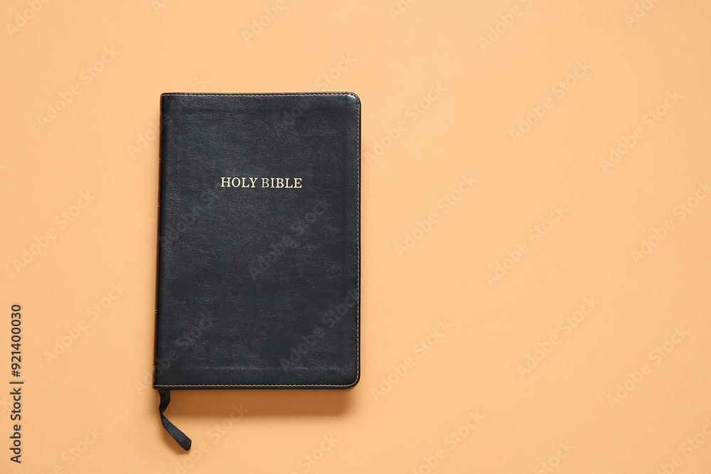 Holy Bible on orange background