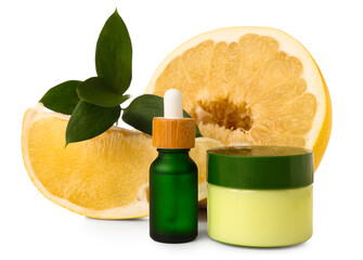 Wall Mural - Beautiful composition with juicy pomelo, jar and bottle of cosmetic products on white background, closeup