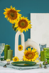 Sticker - Modern table setting with sunflowers in vase near blue wall in room