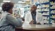 © Sasa Visual - A pharmacist provides advice to a customer at a pharmacy counter