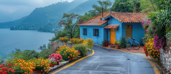 Poster - Charming Blue House on a Hillside overlooking a Lake