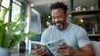 © Lens Legacy - A man is seen thoroughly enjoying a book, enveloped in the cozy ambiance of his bright living room with modern decor and plentiful plants, representing peaceful solitude.