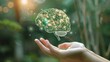 © WACHI - Hand holding a digital brain model with neural connections, symbolizing artificial intelligence and innovation in a natural setting.