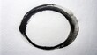 © Adisorn - Abstract creative background featuring a bold, imperfect, freehand-drawn circle in black ink on a white paper, symbolizing spontaneity and artistic expression.
