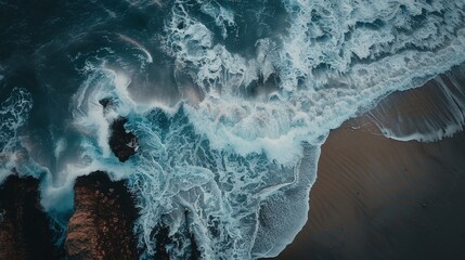 Sticker - Capture an aerial perspective of a beach during a high tide, with waves crashing against rocks and spraying water into the air.