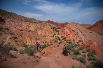 Senior woman hiking in Skazka Canyon in Kyrgyzstan