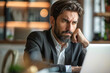 © Golden House Images - Business man feeling stress at office