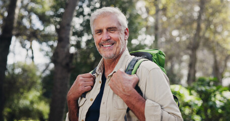 Canvas Print - Portrait, senior man and hiking for fitness outdoor with backpacking mission, trekking adventure or forest journey. Smile, elderly person and travel for exercise, retirement holiday and explore woods