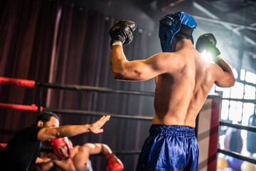 Two young professional boxer having a competition tournament on stage.