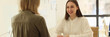 © megaflopp - Business woman communicating with client and making notes in notepad in office
