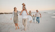 © peopleimages.com - Parents, grandparents and walk with children at beach, sunset and girl on shoulders for holiday. Men, women and kids on care, vacation and piggy back with connection, love and smile by ocean in Spain
