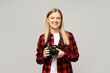 © Atlas - Cheerful girl photographer, on a gray background.