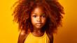 © ALA - Portrait of smiling cute African American child girl with red hair and perfect skin, yellow background, banner.