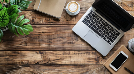 Workplace - Computer and Phone: Computer laptop and mobile phone on a wooden office desk