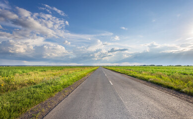 Wall Mural - a long road with a clear blue sky above it