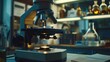© nilanka - Optical microscope in dimly lit laboratory.