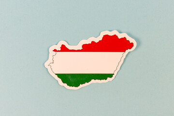 Wall Mural - Hungary Map Shaped Sticker with National Flag Design on Light Blue Background with Copy Space.