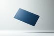 © Kakabe - A floating navy blue rectangular object against a minimalist white background, suitable for use in modern design concepts, business presentations, or artistic visuals to convey simplicity, elegance