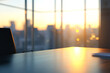 © Linas - Modern Office Desk with Blurred Cityscape at Sunset
