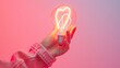 © TGIF - Heart-shaped light bulb held in hand, modern art with Valentine's Day colors, romantic atmosphere.
