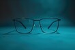 © AiHRG Design - A chic pair of modern glasses rests symmetrically, reflecting light against a calming blue background, creating a stylish focal point.