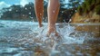 © kodidesign - Close-Up of Bare Feet Walking Through Shallow Ocean Waves, Capturing the Refreshing Feeling of Summer at the Beach