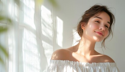 A woman is wearing a white dress and smiling