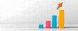 © Punprapa - A rising bar chart with arrows pointing upward, showing the company revenue growth or business growth and return on investment