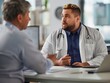 © pavlofox - Doctor consulting with a patient in a modern medical office during the day