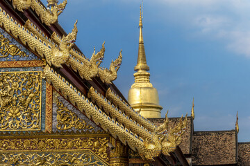 Viharn Luang and the golden dome of Chedi Phrathatluang in the Wat Phra Singh Temple in Chiang Mai, Thailand