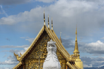 Viharn Luang and the golden dome of Chedi Phrathatluang in the Wat Phra Singh Temple in Chiang Mai, Thailand