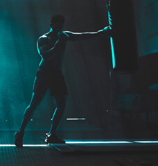 Poster - Man, punching bag and martial arts exercise at gym, training practice and attack challenge for combat. Male person, neon and dojo club aesthetic for boxing competition, athlete and technique workout