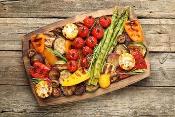 Wall Mural - Delicious grilled vegetables on wooden table, top view