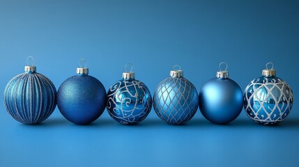 six blue christmas baubles standing on blue background for christmas decoration
