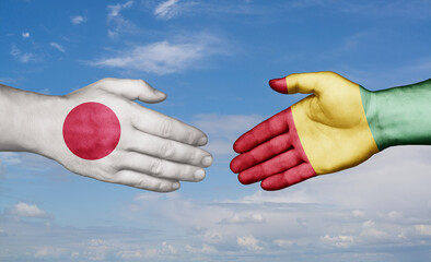 Republic of Guinea and Japan country handshaking with flags, consensus concept international co-operation illustration